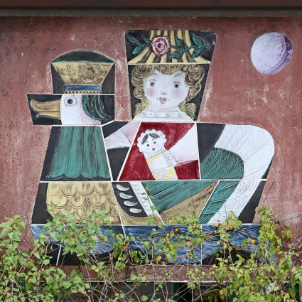 The ceramic work is located above the entrance of a children's day nursery.