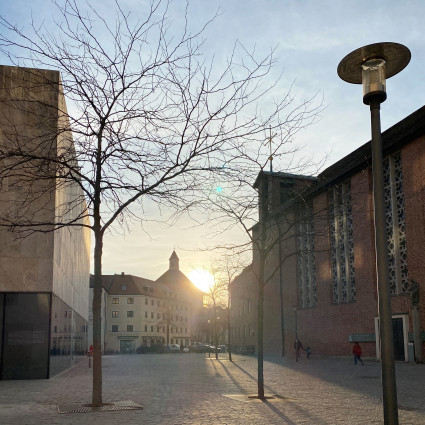 Opposite the Jewish Museum is the St Jakob am Anger monastery (right) on Jakobsplatz, 2023.